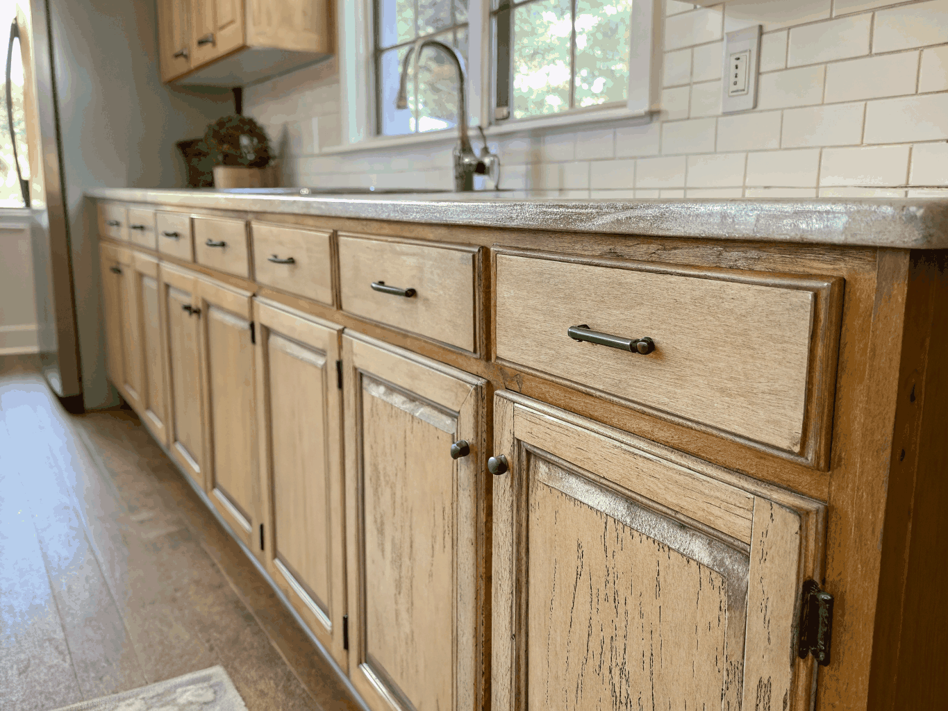 Dated wood kitchen cabinets before priming and prep